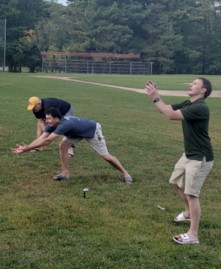 Encorus employees Jerry Sullivan, Dana Pezzimenti, and Joe Lowry try not to get soaked in the water balloon toss