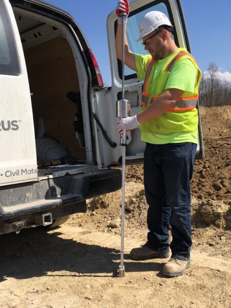 Encorus employee Evan Kolber is pictured here performing dynamic cone penetrometer testing on the subrade for the new roadways at the Arkwright Summit Wind Farm