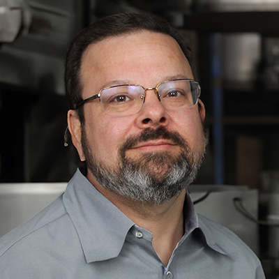 Portrait image of Steven Rakvica, the director of design here at Encorus Group